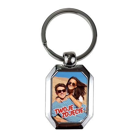 Elegancki ciężki, metalowy, brelok jednostronny.