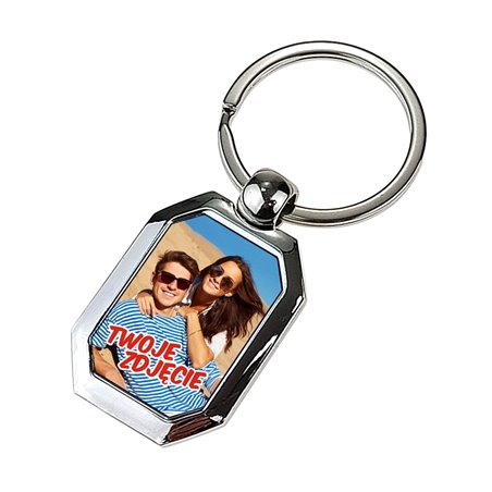 Elegancki ciężki, metalowy, brelok jednostronny.