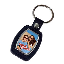 Elegancki ciężki, metalowy, brelok jednostronny ze skórką. 2