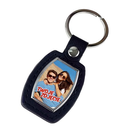 Elegancki ciężki, metalowy, brelok jednostronny ze skórką.